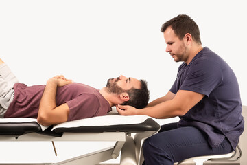 Physiotherapist performing a neck massage on a patient
