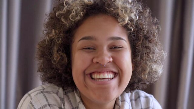 Portrait of a young African woman laughing