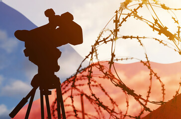 Double exposure - camera, barbed wire and flag Czech Republic