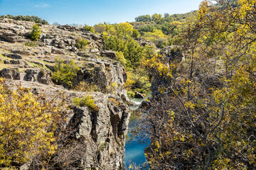 Lozoya river, with the colors of autumn, as it passes through the Sierra de Guadarrama in the province of Madrid