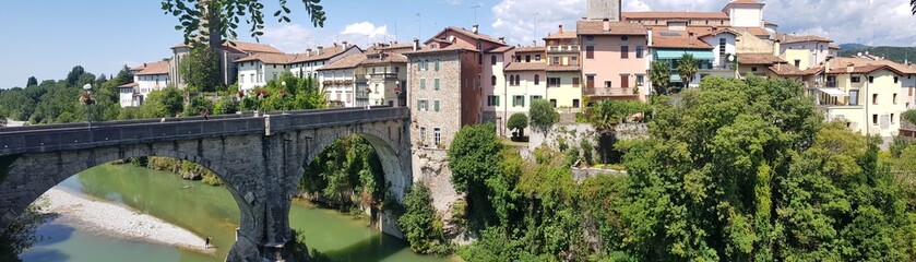 Fototapeta na wymiar Old bridge Ponte del diavolo over Natisone river in Cividale del Friuli - medieval town in Italy, Friuli