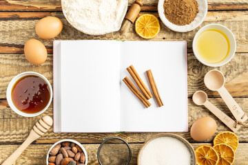 Ingredients for cooking Christmas baking and gingerbread cookies on a wooden background, topview. New Year, holidays, holidays.