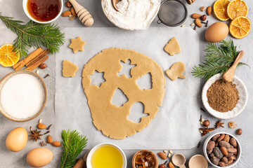 Ingredients for cooking Christmas baking and gingerbread cookies on a wooden background, topview. New Year, holidays, holidays.