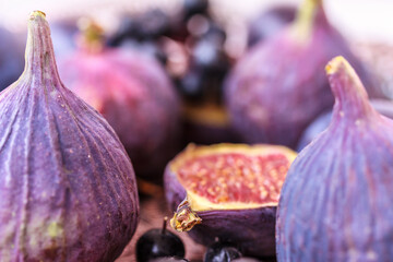 Fresh figs close up on wooden background