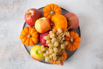 Vegetables and fruits on a table. Healthy food, autumn harvest. Copy space.