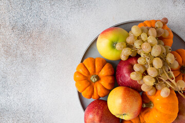 Vegetables and fruits on a table. Healthy food, autumn harvest. Copy space.