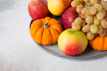 Naklejka na ściany i meble Vegetables and fruits on a table. Healthy food, autumn harvest. Copy space.