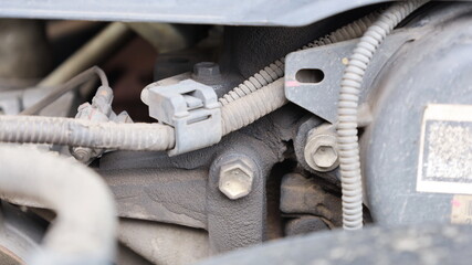 Oil stains with dust on the engine close-up. Dust and dirt components from lack of maintenance or...