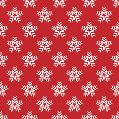 Seamless pattern with red snowflake stars on white background.