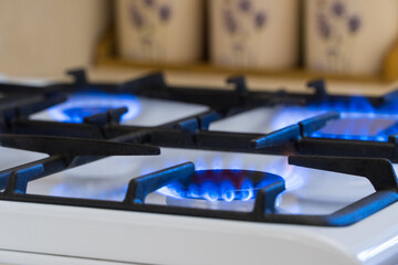 Gas burning in the burner of gas stove, gas shortage and crisis