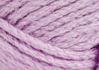 A thread of lavender-colored yarn. Close-up