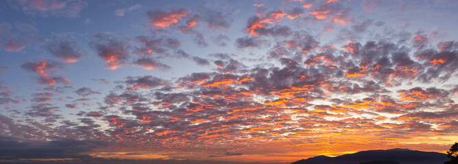 Panoramic View of colorful cloudscape during dramatic sunset on the ocean coast. Taken in Vancouver, British Columbia, Canada. Nature Panorama