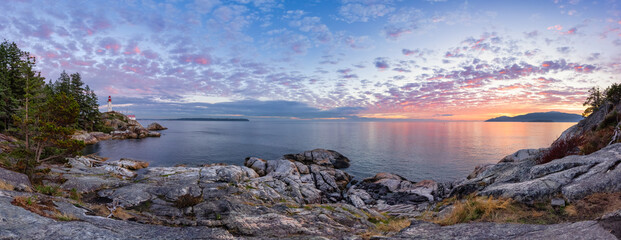 Panoramic view of a Lighthouse Park on a rocky coast during a dramatic cloudy sunset. Horseshoe Bay, West Vancouver, British Columbia, Canada. Nature Background