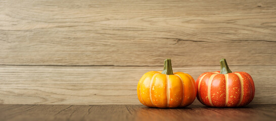 Orange pumpkin on table with copy space for banner background. Happy Halloween day, Hello October,...