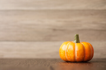 Orange pumpkin on table with copy space for banner background. Happy Halloween day, Hello October,...