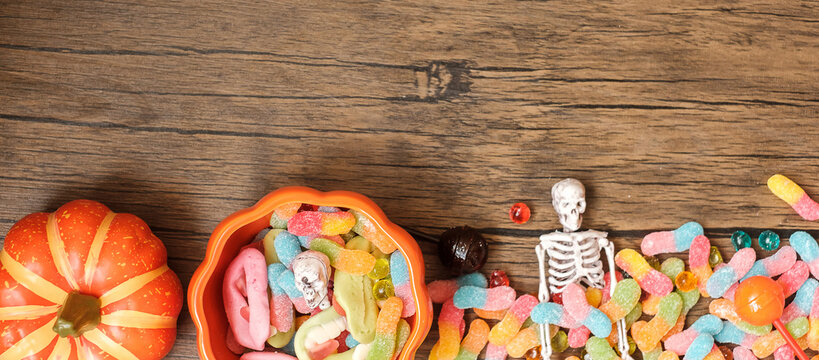 Happy Halloween day with ghost candies, pumpkin,  bowl and decorative. Trick or Threat, Hello October, fall autumn, Festive, party and holiday concept