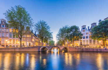 Amsterdam. Panoramic view of the historic city center of Amsterdam. Traditional houses  and bridges of Amsterdam.  A European travel to a historic town. Europe, Netherlands, Holland, Amsterdam.