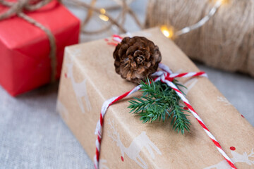 Fototapeta na wymiar Christmas tree gifts in craft packaging