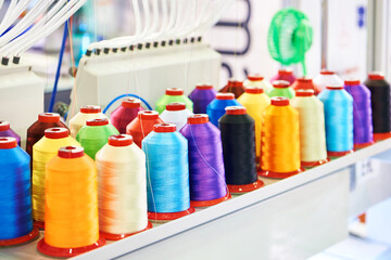 Bobbins with colored thread for industrial textile