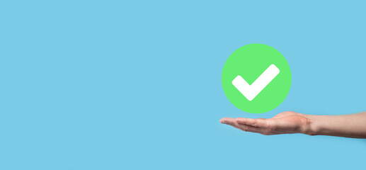 Hand holds green icon Check mark,Check Mark Sign, Tick Icon,right sign,circle green checkmark...