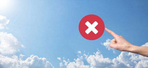 Hand holds icon,cancellation symbol,cancel icon.Cross mark flat red icon.round X mark.cancel...