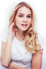 Obraz premium young pretty stylish blond hipster girl posing emotional isolated on white background happy smiling cool smile, lifestyle people concept