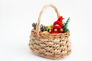 Fototapeta na wymiar Christmas basket with toys on a white background