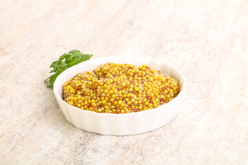 Grain mustard sauce in the bowl