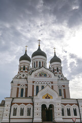 Fototapeta na wymiar Alexander Nevsky Cathedral in Tallinn, Estonia, during a beautiful summer day with clouds on the sky. Orthodox church architecture.