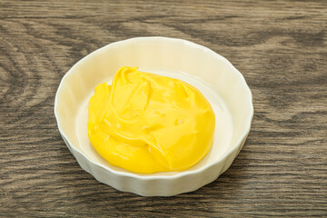 Natural cheese sauce in the bowl