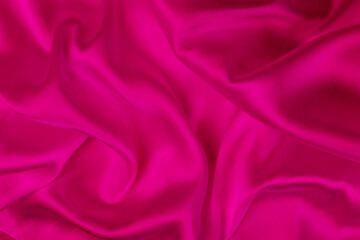 pink color satin silk with waves, abstract background luxury cloth, elegant wallpaper design.Abstract background luxury cloth or liquid wave