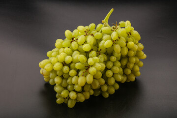 Green grape branch over background