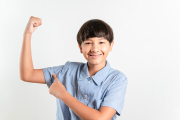 Portrait of a confident young handsome mixed race boy standing while showing his arm muscle biceps look at the camera. Raising good health strong and energy concept. White background for copy space