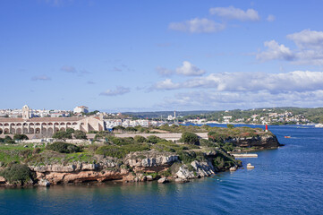 Fototapeta na wymiar L'Illa del Rei Hospital Island in the middle of the main navigable entry channel to Mahon in Menorca in the Mediterranean Sea