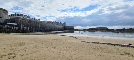 Beach along the old city walls outside Saint Malo walls, Brittany, France