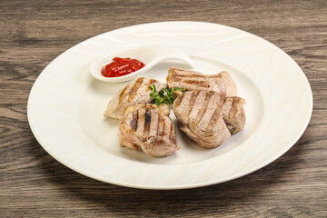 Grilled pork tenderlion with tomato sauce