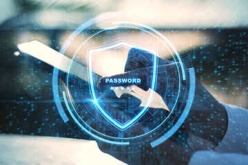 Close up of hands holding tablet with glowing protection shield on blurry outdoor background. Login and web safety concept. Double exposure.