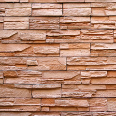 Brown sand stone brick wall or stone wall texture and background