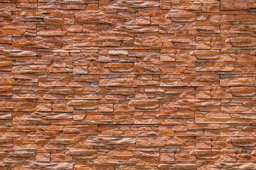 Brown sand stone brick wall or stone wall texture and background