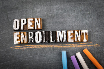 Open Enrollment. Word on a dark chalk board