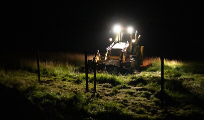 Excavator during night work