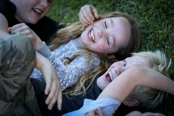 Happy cousins having fun together in Australian backyard