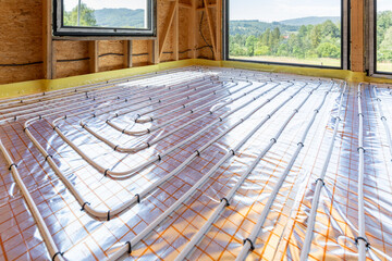 Underfloor heating system installed in house under construction