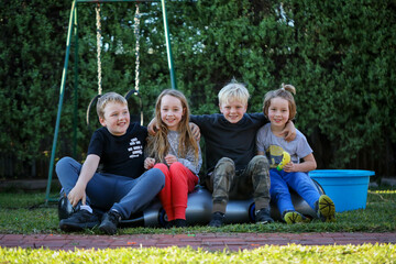 Happy cousins having fun together in Australian backyard