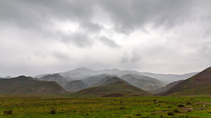 Panorama of mountains in rainy cloudy weather