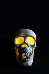 human skull with yellow eyeballs