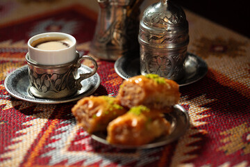 Small cup of Turkish coffee and Turkish baklava