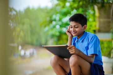 Cute indian little child studying at home