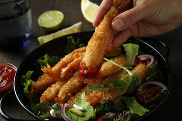 Сoncept of tasty eating with deep-fried shrimp, close up