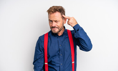 middle age handsome man feeling confused and puzzled, showing you are insane